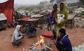 Several people were observed burning wood to stay warm