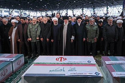 Haniyeh praying behind Khamenei during the funeral of Qasem Soleimani