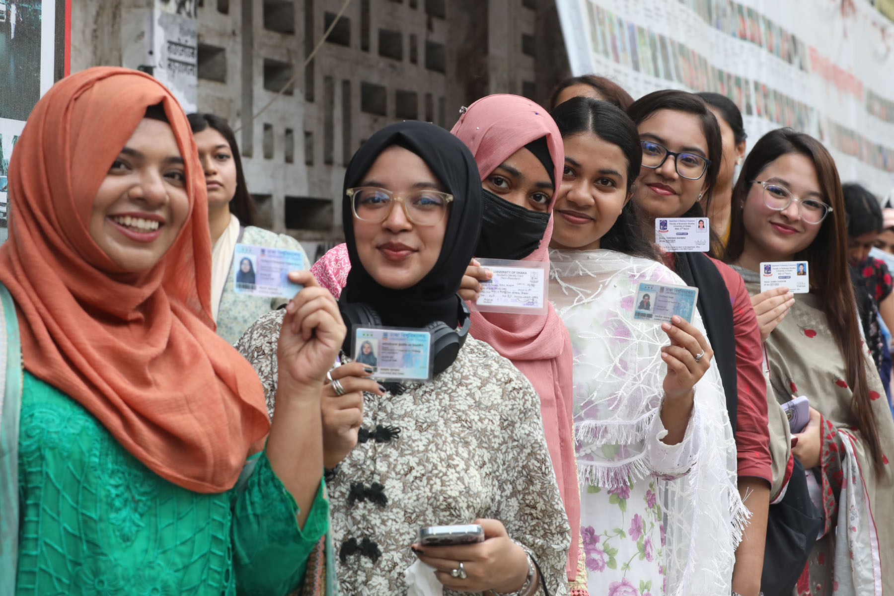 Dhaka University student presents their ID card while queuing to cast their vote during the DUCSU and hall elections. Photo: AH Mintu/V7N