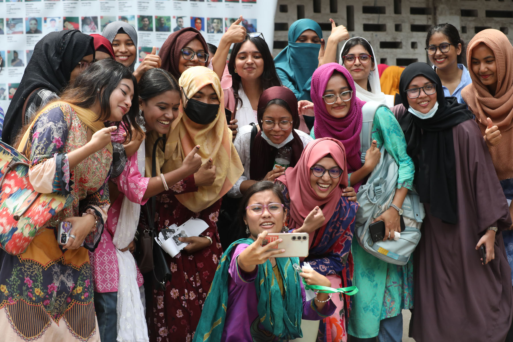 Students take selfies and capture moments of excitement outside polling centers after casting their votes in the DUCSU and hall elections at Dhaka University. Photo: AH Mintu/V7N
