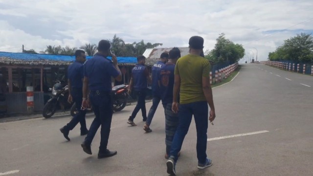 Police patrol the area in Mongla Sonatola as tensions rise over road construction near a bridge. Photo: V7N