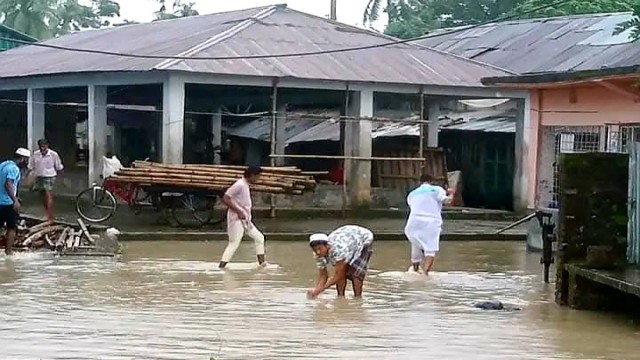 Waterlogged streets in Jhalokati Rajapur area after continuous heavy rainfall, disrupting transport and daily activities as low-lying areas remain submerged.