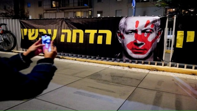 picture of a banner, during a protest against Israeli Prime Minister Benjamin Netanyahu's government in Tel Aviv