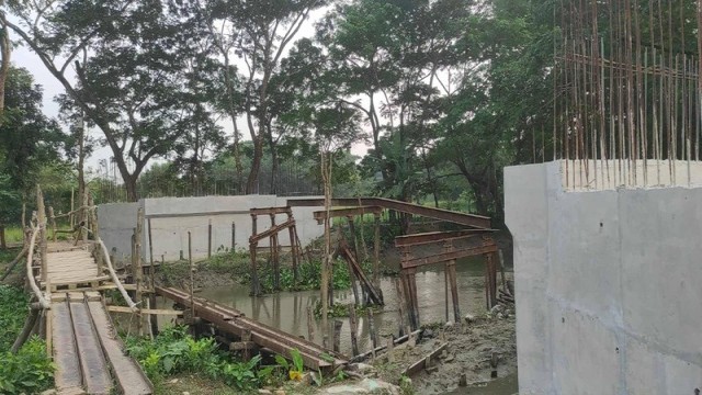 Contractor Flees, Tk 4 Crore Bridge Now Reduced to a Risky Wooden Walkway!