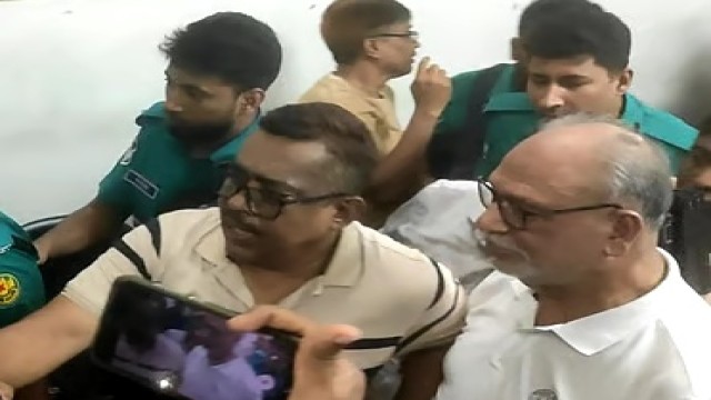 Former minister Abdul Latif Siddique is taken into custody by police after protests erupted during a political gathering at the Dhaka Reporters Unity auditorium.