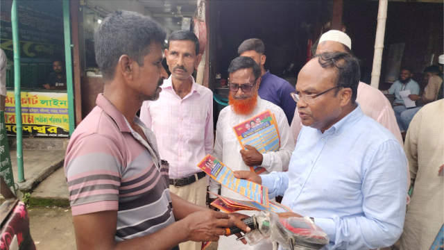 Former Mongla Mayor and BNP Leader Md. Zulfiqar Ali distributes 31-point reform leaflets across Mongla town, urging public support for Tarique Rahman’s national reform agenda.