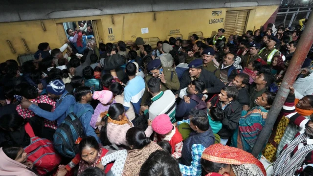 Rescue workers and police at the scene of the stampede at New Delhi Railway Station, where 18 people tragically lost their lives ahead of the Maha Kumbh Mela.