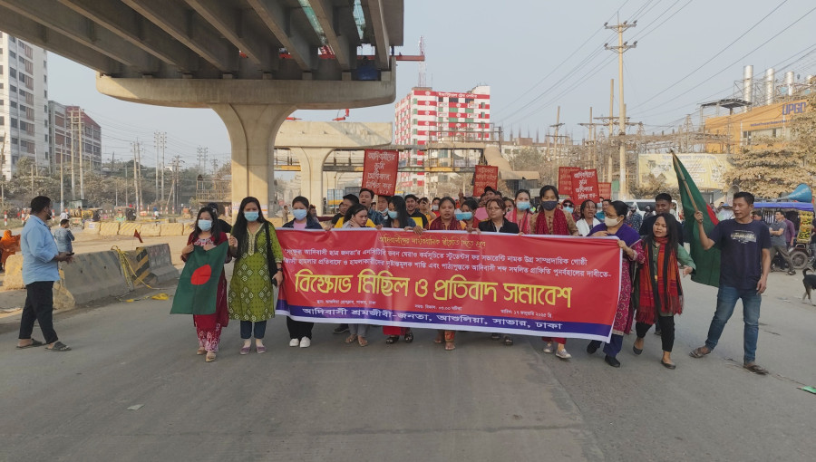 Indigenous protesters in Ashulia march with banners demanding justice and the reinstatement of indigenous terms in textbooks.