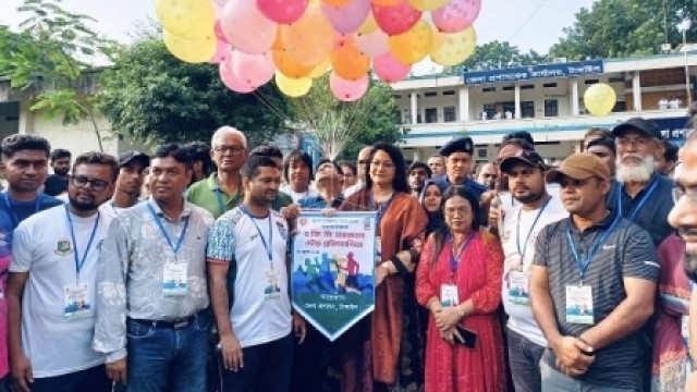 Tangail Deputy Commissioner Sharifa Haque inaugurates the symbolic marathon by releasing balloons at the DC office, accompanied by Additional Deputy Commissioner Abdullah Al Mamun and other officials.