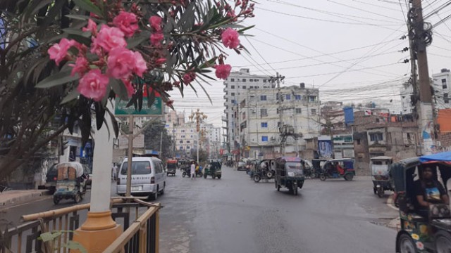 Rajshahi residents enjoy the cool rainwater as a light drizzle brings relief from the heat wave on Monday, March 17.