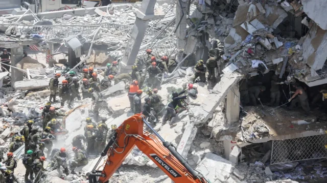 Rescue efforts amid rubble in Tehran, where buildings have been reduced to debris following repeated airstrikes