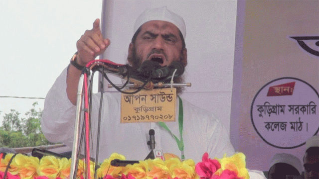 Bangladesh Khelafat Majlish Amir Mamunul Haque addresses a mass rally at Kurigram Government College Field, warning the interim government against foreign influence and calling for a free and fair election process.