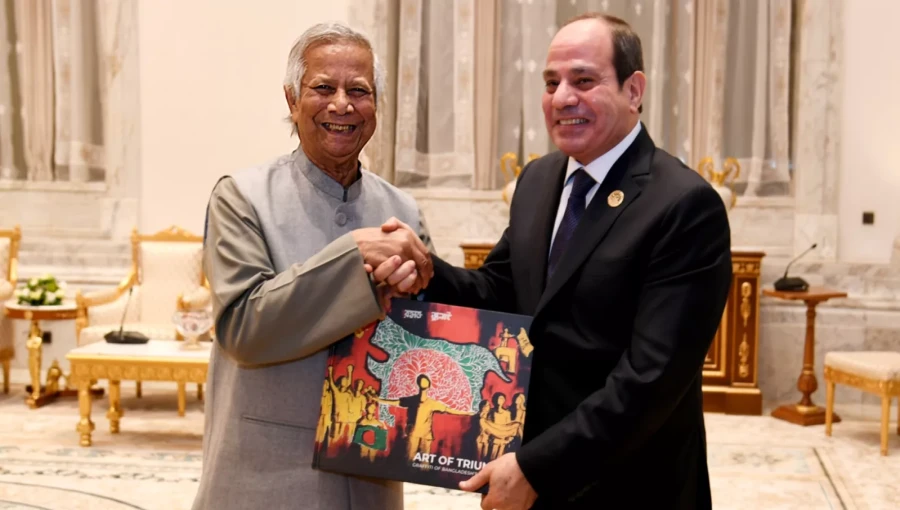 Professor Muhammad Yunus, Chief Adviser of Bangladesh, presents a copy of The Art of Triumph, an art book featuring wall graffiti and murals from the July mass uprising, to Hussein Al Sheikh, Secretary General of the Palestine Liberation Organization, during their meeting at the D-8 Summit in Cairo.