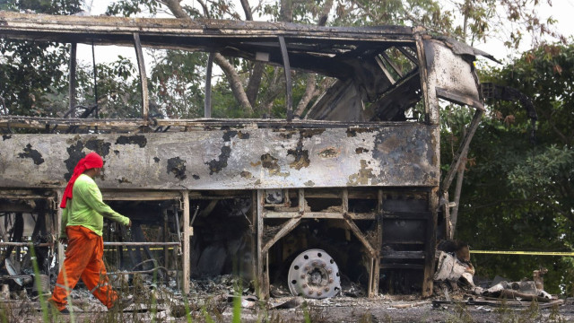 The aftermath of a deadly crash in southeastern Mexico, where a truck veered into a bus’s lane, causing both vehicles to catch fire.