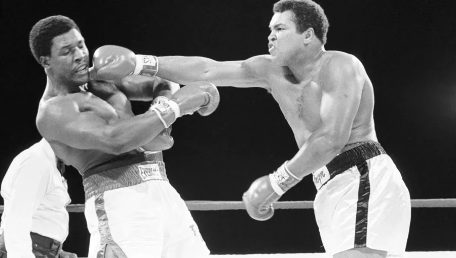 "Muhammad Ali: The Champ Who Defied the Odds and Captured Hearts at the Rumble in the Jungle, reclaiming his title and inspiring a generation."