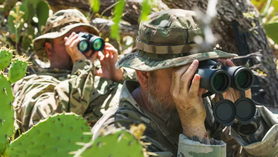 Volunteers Lorenzo Murillo (right) and Calvin Stowers from Arizona Border Recon monitor the mountains near the U.S.-Mexico border, keeping an eye out for smugglers or drug traffickers.