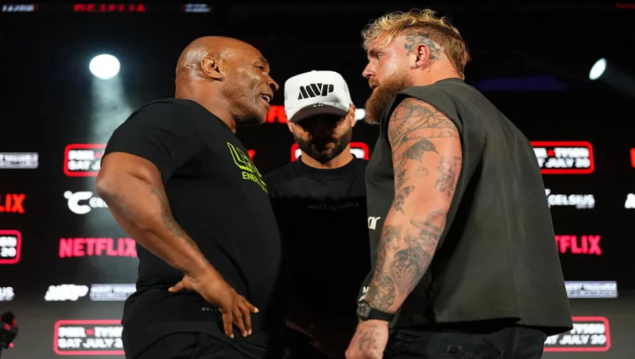 Mike Tyson (left) and Jake Paul (right) prepare for their highly anticipated boxing match at AT&T Stadium on Nov. 15, with experts divided on who will come out on top.