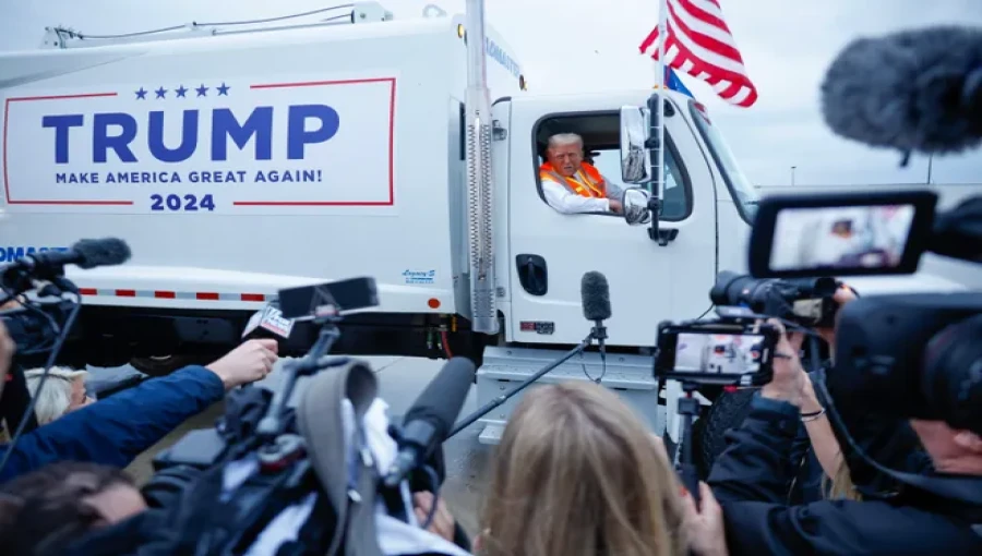 Former President Donald Trump arrives at his rally in Green Bay, Wisconsin, driving a customized garbage truck—a bold response to President Biden's recent remarks about Trump supporters.