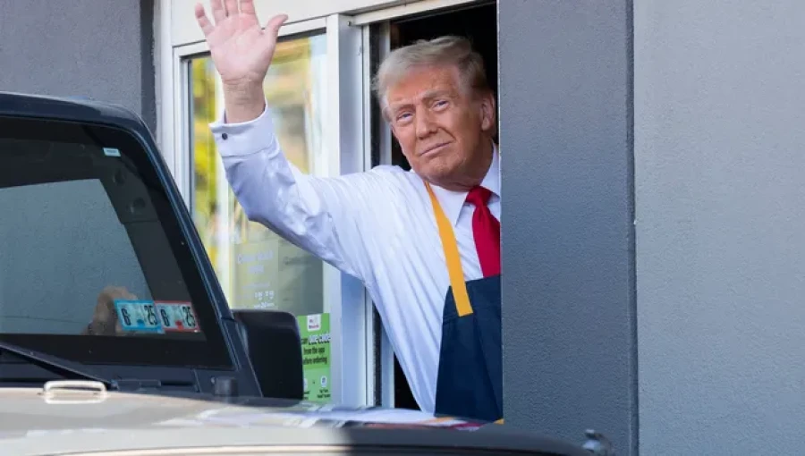 "Donald Trump driving a garbage truck in a campaign photo, sparking viral reactions online."