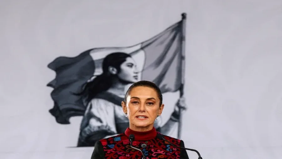 Mexican President Claudia Sheinbaum Pardo points to a 17th-century map during a press conference in Mexico City, rejecting U.S. President-elect Donald Trump's proposal to rename the Gulf of Mexico.