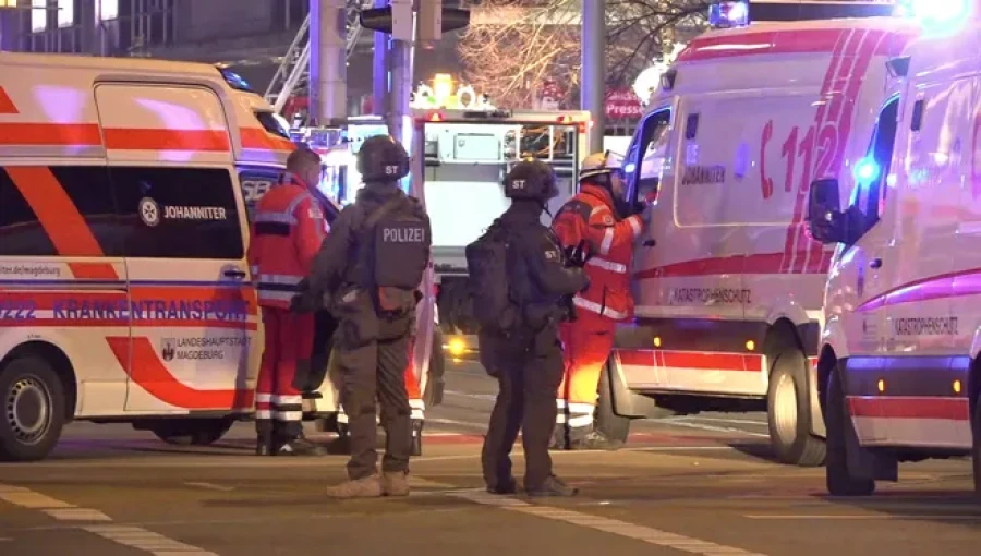 "Emergency responders at the scene where a car crashed into a crowd at a Christmas market in Magdeburg, Germany, on December 20, 2024, leaving at least two dead and dozens injured."