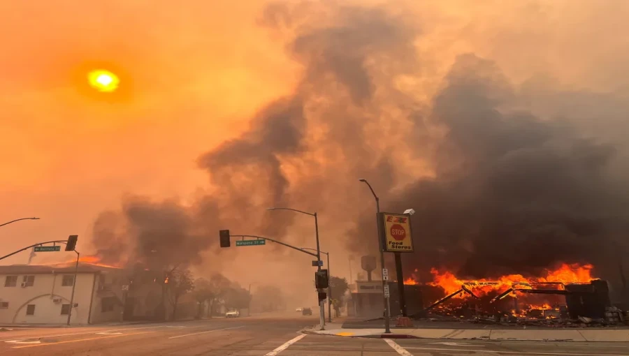 Flames engulf a house in Altadena, California, during the wind-driven Eaton Fire on January 8, 2025. The wildfire, fueled by hurricane-force winds, rapidly consumed over 200 acres, prompting widespread evacuations in the Los Angeles region.