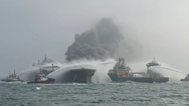 A cargo ship and oil tanker collide off the coast of England, causing fires and injuring dozens.