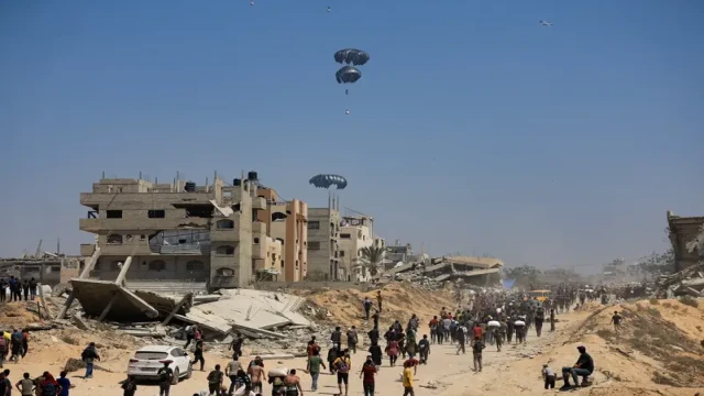 Humanitarian aid is airdropped over Gaza, seen from the northern Gaza Strip, on July 27, 2025, amid ongoing conflict and deepening humanitarian crisis.