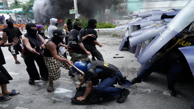 Protesters clash with police during anti-corruption demonstration in Manila over alleged irregularities in the flood control projects.