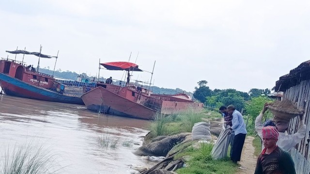 Students and teachers at Chakrajapur High School in Rajshahi place sandbags along the Padma Riverbank in a desperate effort to save their school from erosion, as parts of the campus have already collapsed into the river.