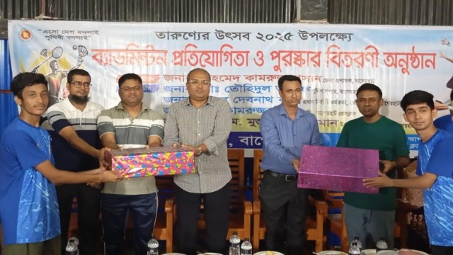 Deputy Commissioner Ahmed Kamrul Hasan hands over trophies to winners of the Youth Festival 2025 Badminton Tournament held in Bagerhat.
