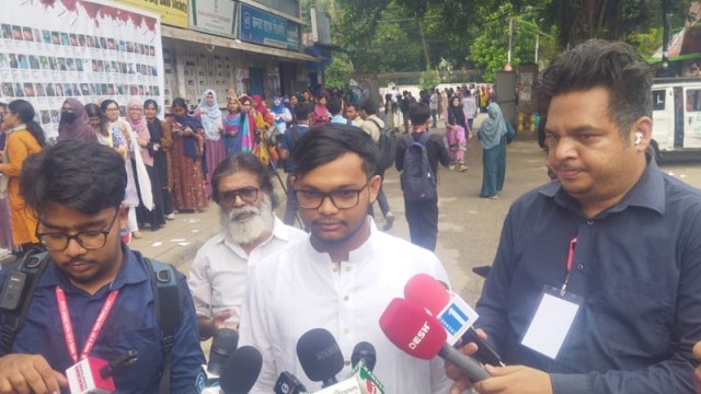 General Secretary (GS) candidate Abu Bakar Majumder speaks to journalists at the TSC polling center during the Dhaka University DUCSU elections.