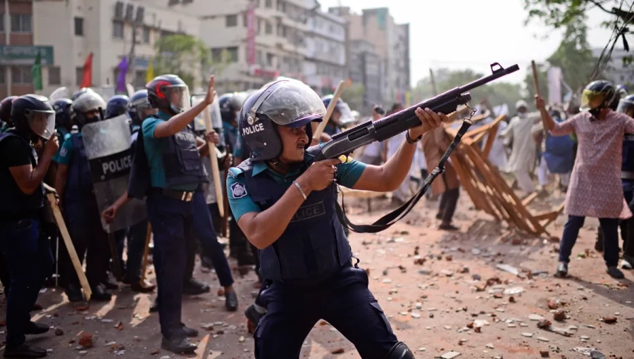 Riot police in full gear confront demonstrators during the civil unrest in Dhaka, Bangladesh, in July 2024. The clashes, sparked by political and economic grievances, led to widespread reports of human rights violations, including the use of excessive force by security forces. The UN is now investigating these incidents as part of a broader fact-finding mission.