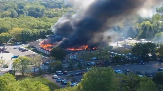 Massive flames and thick smoke engulf The Church of Jesus Christ of Latter-day Saints in Grand Blanc, Michigan, on Sunday, September 28, 2025, after a gunman opened fire and set the building ablaze. (Photo: AP)