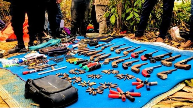"22 guns and various equipment including  a hundred rounds of ammunition and 4 mines were recovered"