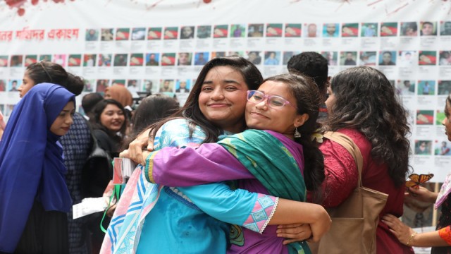 Two Dhaka University students embrace outside a polling center, celebrating and expressing joy after casting their votes in the DUCSU and hall elections. Photo: AH Mintu/V7N