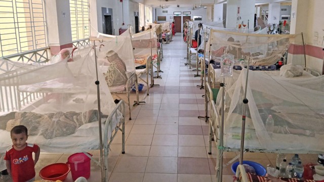 Patients receiving treatment in the dengue ward of a hospital in Dhaka, as the country continues to see a rise in dengue cases during the monsoon season. In the past 24 hours alone, 448 new patients were admitted nationwide.