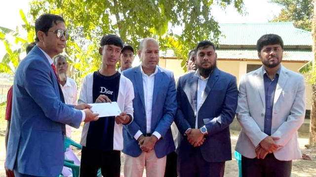 District Commissioner Mohammad Habibullah visits the remote hilltop homes in Longadu to provide financial aid to students injured during the mass uprising.