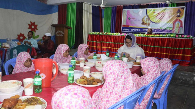 Tangail District Commissioner Sharifa Huq sharing Iftar with orphan children at the Government Children's Home (Girls) on the first day of Ramadan. The event was organized by the district administration to highlight the significance of Ramadan.