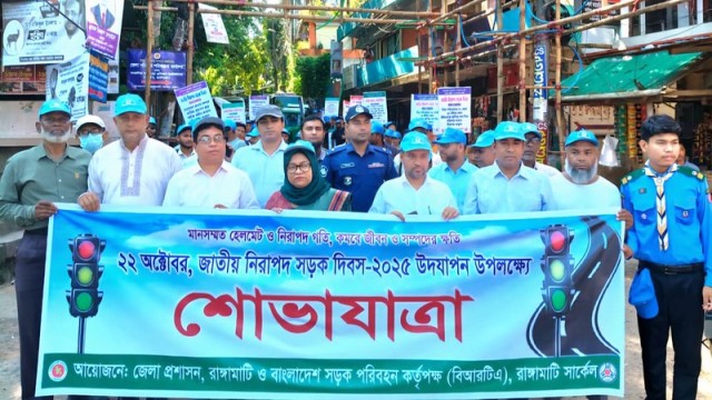 Participants march through Rangamati streets in a colorful rally to mark Safe Roads Day 2025.