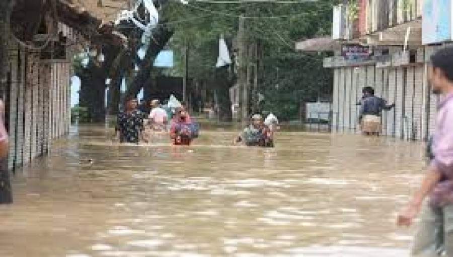 Residents of Feni form a human chain in knee-deep floodwaters, demanding international accountability, equitable water sharing, and compensation for flood damage.