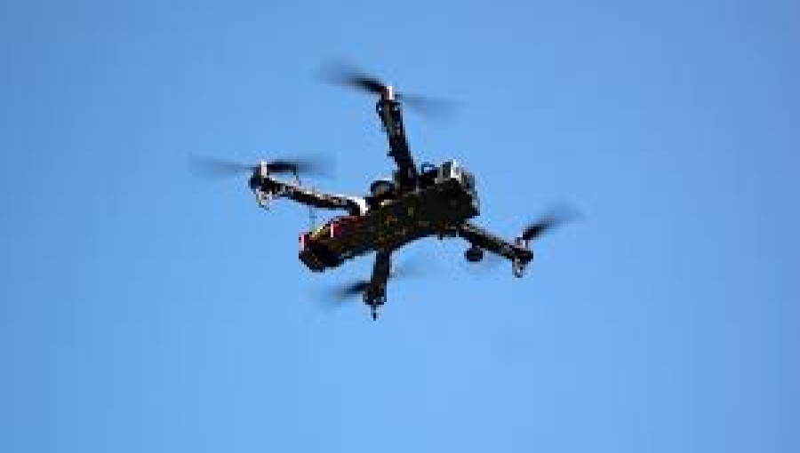 "A drone flying over city, as temporary flight restrictions are imposed over critical infrastructure sites in New York and New Jersey."