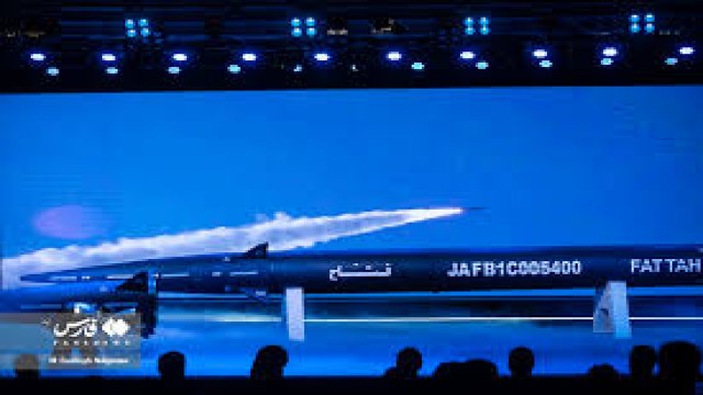 "Iran's Fattah hypersonic missile is displayed during an unveiling ceremony in Tehran. Iranian officials claim the missile can evade advanced air defense systems and reach speeds exceeding Mach 13."