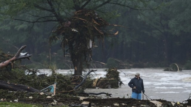First responders search along the flooded banks of the Guadalupe River in Ingram, Texas, as recovery efforts continue for those swept away by the sudden flash flood.