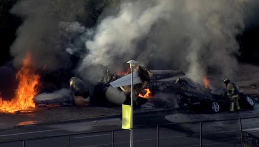 Emergency responders at the scene of a deadly plane crash near Falcon Field Airport in Mesa, Arizona, where five people were killed.