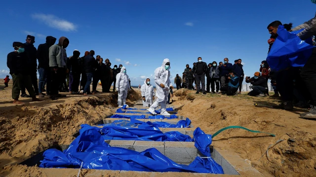 “Mass burial of Palestinians killed during the ongoing conflict takes place in Rafah, Gaza."