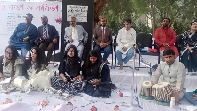 Islamic University hosts 'Ekusher Kotha O Kobita' at the First Shaheed Minar in tribute to the Language Martyrs.