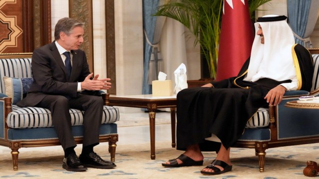 US Secretary of State Anthony Blinken with Qatar's Emir Sheikh Tamim bin Hamad Al Thani at Lusail Palace.