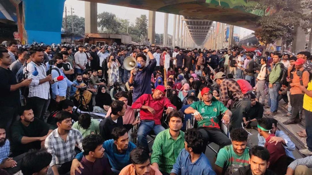 Students of Titumir College block the Mohakhali rail crossing in Dhaka on Monday, February 3, 2025.