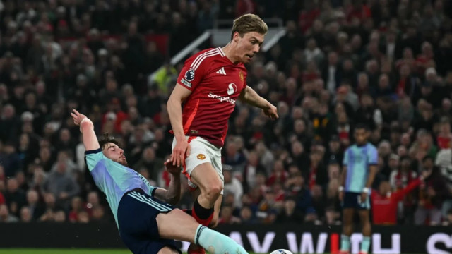 Arsenal's Declan Rice makes a last-ditch tackle on Manchester United's Rasmus Hojlund during Sunday’s Premier League match at Old Trafford, north west England Photo: AFP